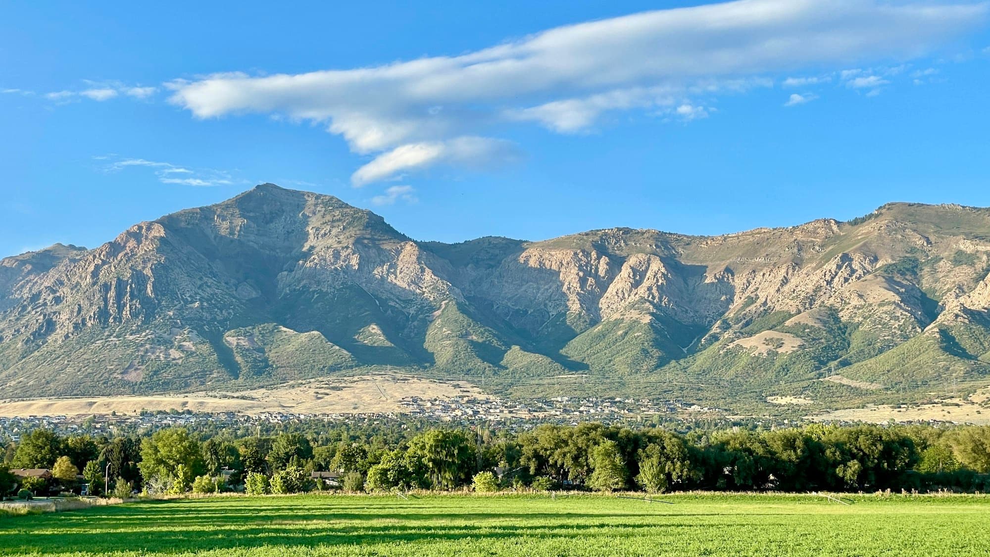 The Midway and Heber Valley town nestled below the green Wasatch Range in summer