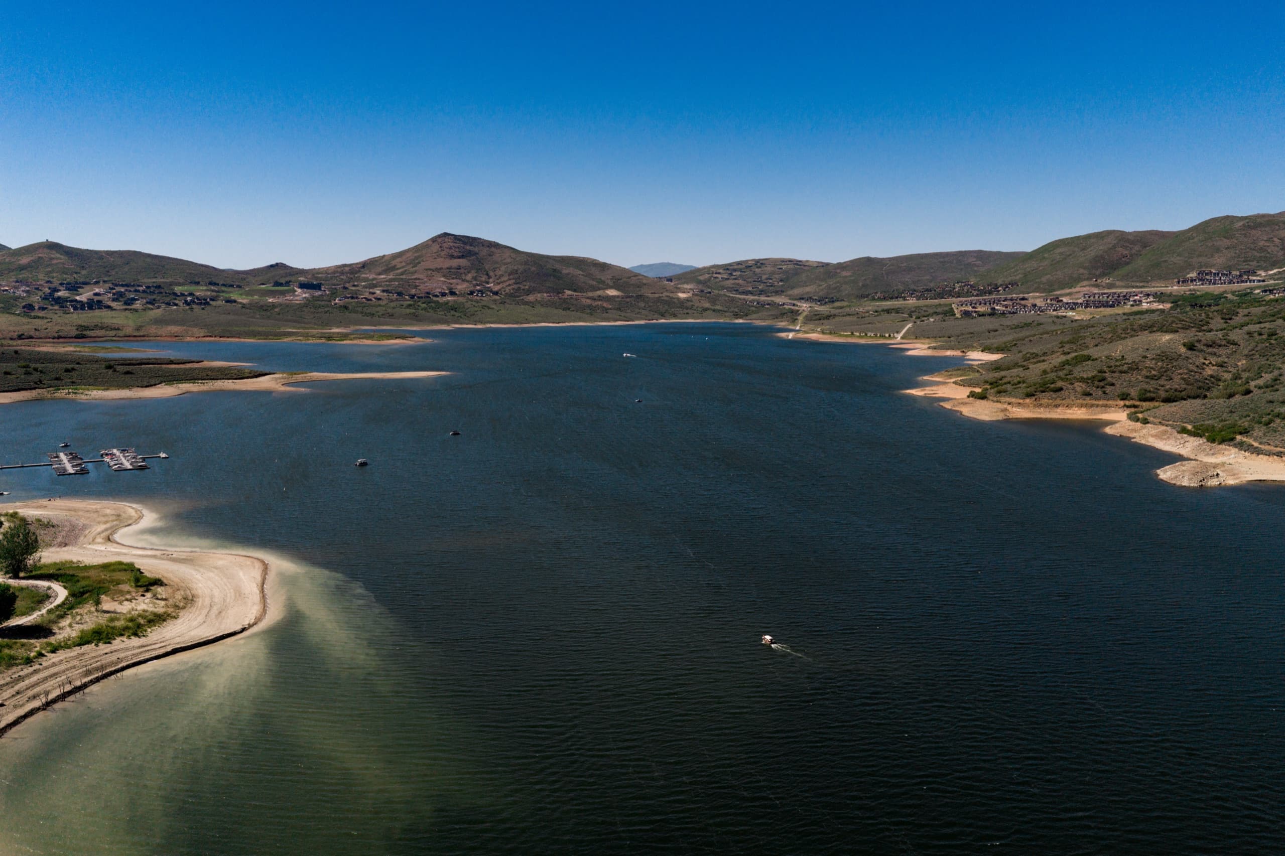 Wide aerial vista of Jordanelle Reservoir and the Wasatch — the closest alpine reservoir to Salt Lake City