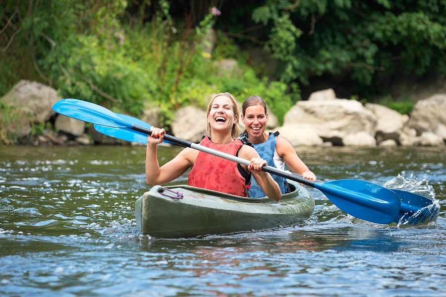 How to Safely Kayak on the Same Water as Boats